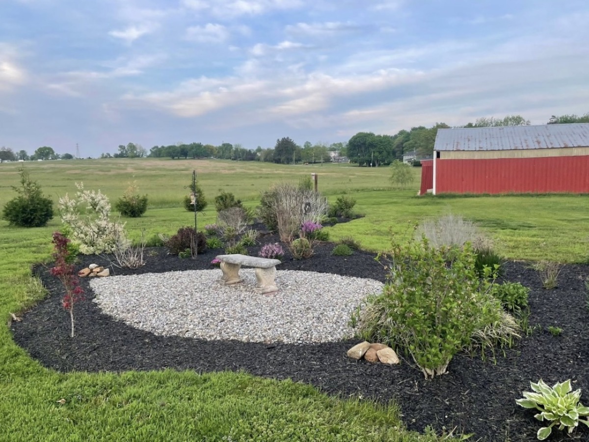 Garden bed with stone bench