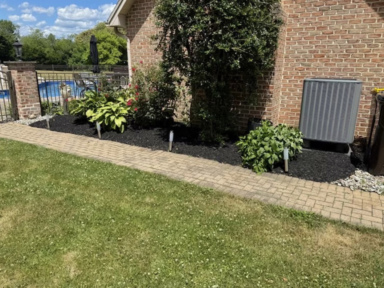 Clean landscape bed installed along a home's foundation